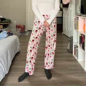 Soft and stretchy holiday pajama pants with bow pattern